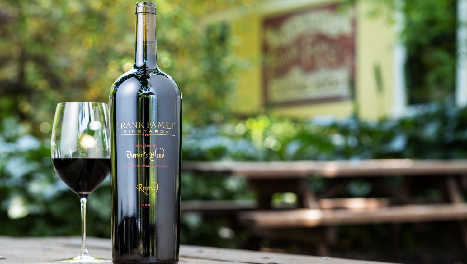 Frank Family Owner's Blend at a picnic table in summer