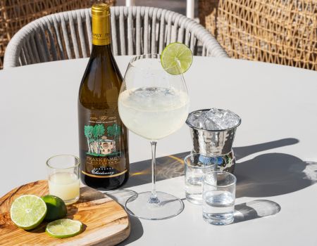 Frank Family's Carneros Chardonnay displayed next to a wine margarita cocktail