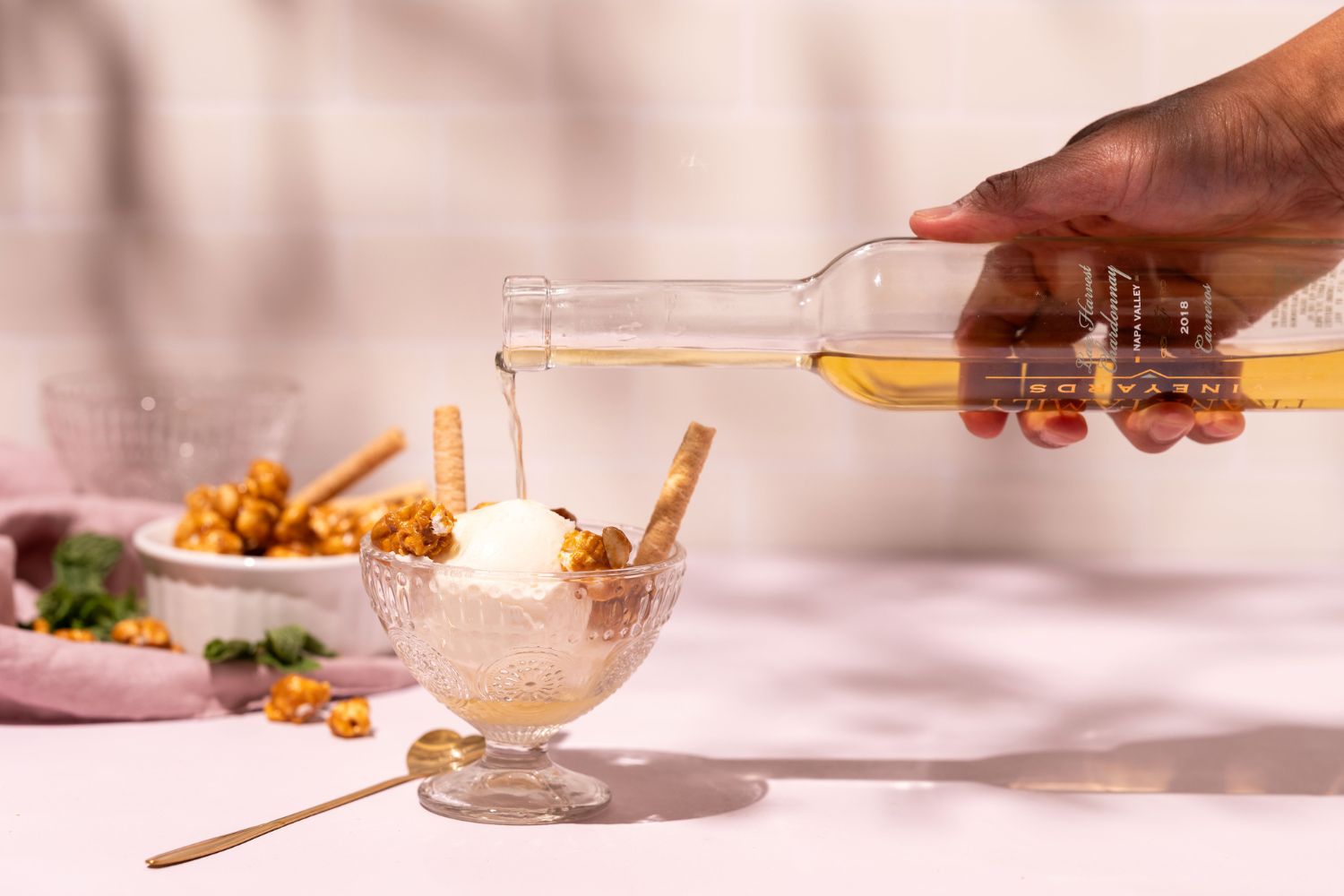 Ice cream sundae with Late Harvest Chardonnay being poured on top