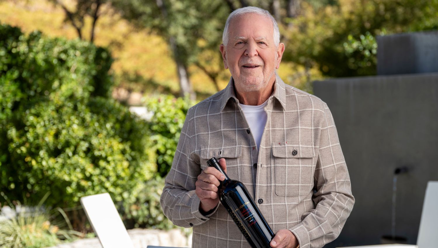 Rich Frank with bottle of RHF Cabernet Sauvignon in the fall-colored Winston Hill Vineyard