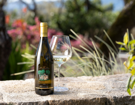 Bottle of Frank Family Carneros Chardonnay next to a full glass.