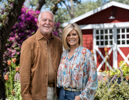 Frank Family founders Rich & Leslie Frank in front of their red barn.