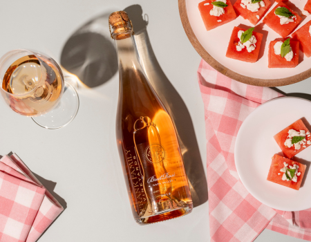 Overhead shot of Frank Family's Brut Rosé alongside fresh watermelon.