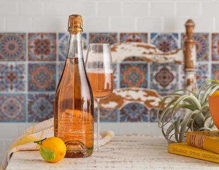 brut rose on table with glass